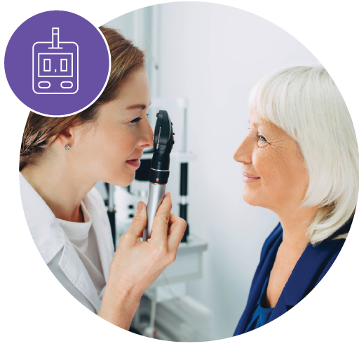 eye doctor checking the eyes of an elderly